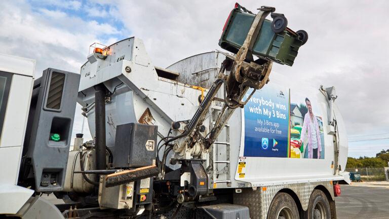 Rubbish truck collecting a bin