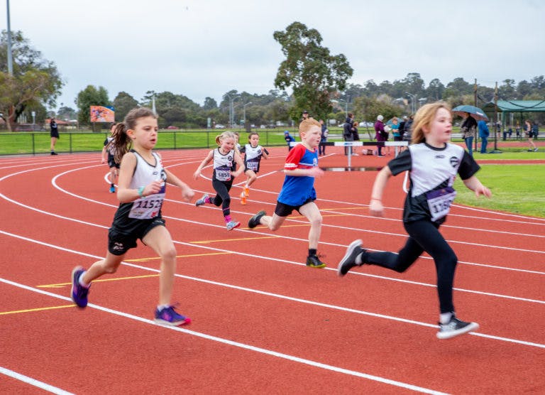 athletic track with children running